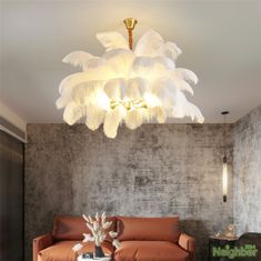 a living room filled with furniture and a chandelier hanging over the top of it