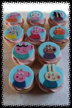 there are many cupcakes that have peppa faces on them, all decorated in blue and pink