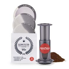 the aeropress coffee grinder is next to several discs and a packet of ground coffee