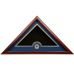 a triangle shaped plaque with an emblem on the front and bottom in blue, gold and black