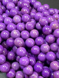 purple candy balls are piled on top of each other