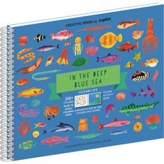 a spiral notebook with an image of various sea animals and fish in the deep blue sea