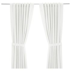 two white curtains hanging on a metal rod