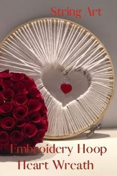 a heart - shaped piece of art with the text embroidery hoop heart wreath