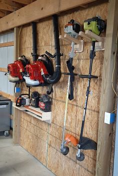 a garage with tools hanging on the wall