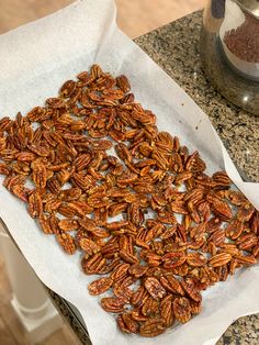 there are pecans on the counter ready to be cooked and put in the oven