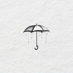 an umbrella with rain drops hanging from it