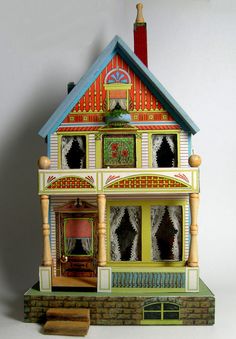 a doll house with an open front door and two stories on the second floor is shown