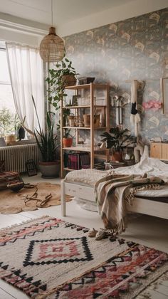 a bed room with a neatly made bed and a rug on the floor next to it