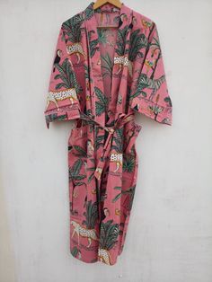 This Robe we makes from 100% Cotton printed fabric. The fabric print is Anokhi Floral which is very popular in all over the world . We use pure cotton cambric fabric . This is free One size robe . There is both side pocket in robe. Length = 120 cms. ( 48 inches) Printed Pink Sleepwear For Home, Pink Printed Sleepwear For Home, Pink Summer Robe For Bedtime, Summer Pink Robe For Bedtime, Red Printed Cotton Sleepwear, Printed Cotton Robe For Home, Summer Sleepwear Kimono With Prints, Multicolor Cotton Home Robe, Pink Cotton Sleep Robe