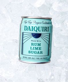 a can of daiquiri rum lime sugar sitting on top of some ice crystals