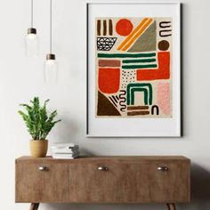 a painting hanging on the wall next to a wooden dresser and potted green plant