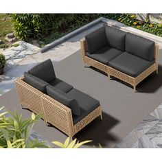 an outdoor patio furniture set with black cushions and grey cushions on the floor next to a pool