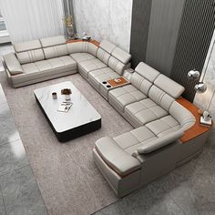 a modern living room with white and brown leather couches, coffee table and lamp