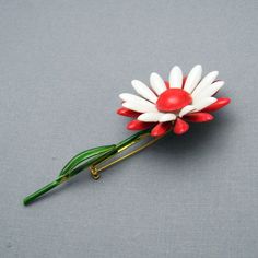 Vintage flower brooch on stem is a wonderful pop of color with a green stem and red and white flower. In excellent vintage condition, signed Original by Robert, 3 1/2 inches tall with the flower being about 1 5/8 inch in diameter. Find lots more vintage jewelry at Purple Daisy Jewelry! http://www.etsy.com/shop/purpledaisyjewelry Thanks a bunch for shopping for vintage jewelry at Purple Daisy Jewelry on Etsy! Daisy Jewelry, Purple Daisy, Thanks A Bunch, Enamel Flower, Flower Pins, Flower Brooch, White Flower, Austin Tx, Vintage Flowers