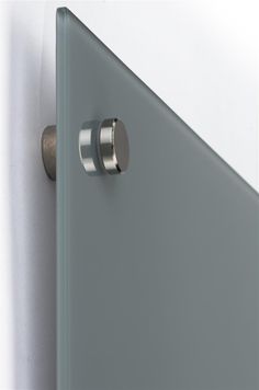 a close up of a door handle on a white wall