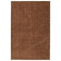 a brown rug on a white background with no one in the room to see it