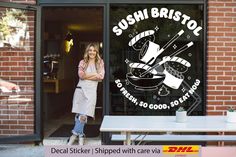 a woman standing in the doorway of a restaurant