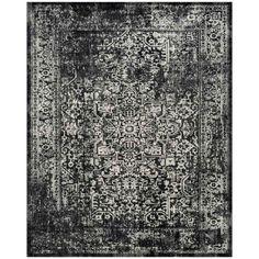 an area rug with black and white designs on the front, in shades of gray