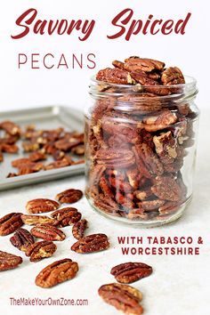 a glass jar filled with pecans on top of a table