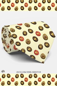 an image of a neck tie with chocolates on it and gold circles around the neck