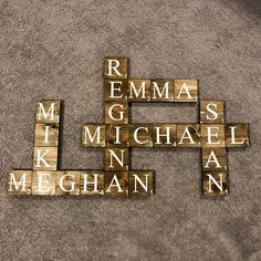 wooden blocks spelling the names of different languages on carpeted area with white rugs