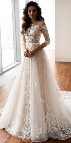 a woman in a wedding dress standing on a wooden floor with her hand on her hip