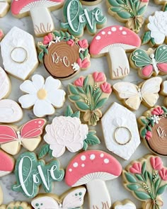 decorated cookies are arranged on a marble surface