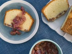 three bowls of food on a blue table cloth with bread and beans in the bowl