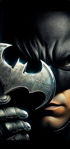 the dark knight rises character poster with batman's face and hands on his chest