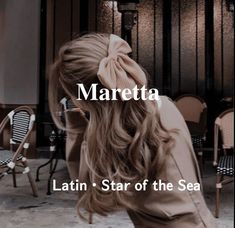 a woman with long hair standing in front of a table and chairs, text reads maretta latin star of the sea