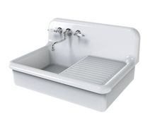 a white sink with two faucets on the side and a drain in the middle