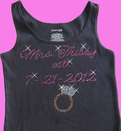 a black tank top with pink and gold sequins on the front that says mr baby & mrs 2013