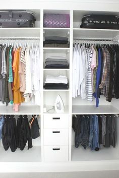 an organized closet with clothes hanging on shelves