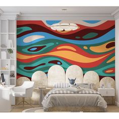 the bedroom is decorated with an artistic wall mural