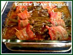 green bean bundles with bacon in a glass dish