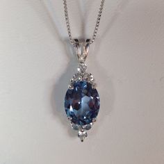 "Gorgeous London Blue Topaz & White Topaz Necklace * Oval Cut London Blue Topaz measures 10mm x 8mm * Brilliant Cut White Topaz Accents measure 2.5mm each * 4cts total Gemstone weight * 10k or 14k Gold - Select your Gold Karat and Color * 16\" or 18\" Chain Included Hallmarked & Gift Ready! Matching Earrings can be found here https://www.etsy.com/listing/523716379/beautiful-6ctw-london-blue-topaz-white Matching Ring Can be found here https://www.etsy.com/listing/496856981/gorgeous-5ctw-london-bl White Sapphire Necklace, White Topaz Necklace, Dove Necklace, Gold Jewelry Gift, Trending Jewelry, Setting Ideas, August Birthstone Jewelry, Solitaire Pendant Necklace, Matching Ring