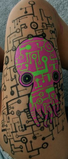 a person with an octopus tattoo on their arm and head is covered in music notes