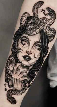 a woman with a snake tattoo on her arm