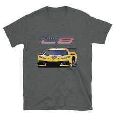 a gray t - shirt with the image of a yellow sports car in front of an american flag