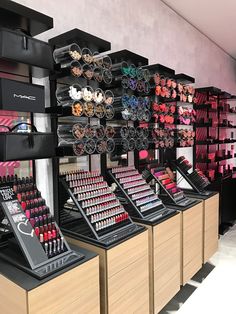 there are many lipsticks on display in the store