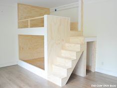 the stairs are made out of plywood and have been built into the wall for storage