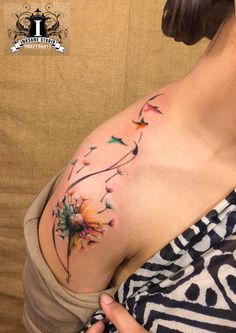 a woman's chest with flowers on it