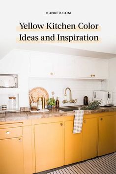 a kitchen with yellow cabinets and white walls