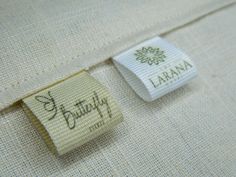 a close up of a label on a white shirt with the name lanana printed on it