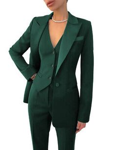 a woman wearing a green suit and pearls