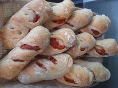 a basket filled with pastries covered in bacon