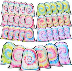 tie - dyed backpacks are lined up and ready to be used