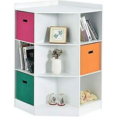 a white book shelf with four different colored bins on each side and one is empty