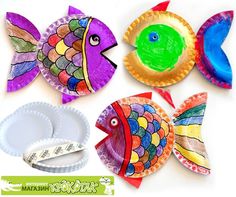 paper plates with colorful fish on them sitting next to each other in front of a white background